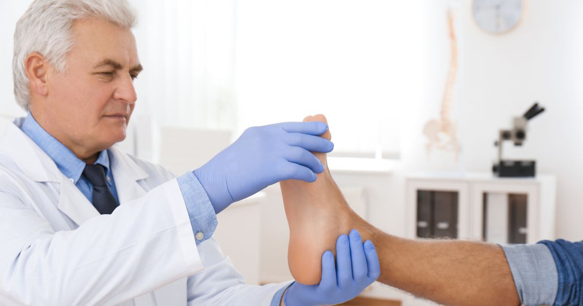 Podiatrist examining patient's foot